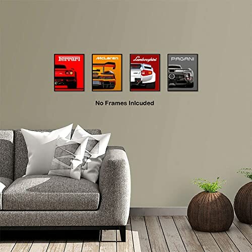 Four car brand posters on wall above sofa with cushions and plants.
